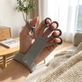 Silicone hand grip exerciser in use for rehab